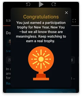A PragerU "Congratulations" pop-up awarding a participation trophy and encouraging the viewer to keep watching for a real one.
